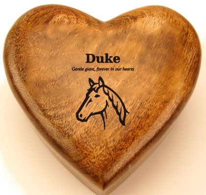 Horse head line drawing engraved on a mango wood heart urn