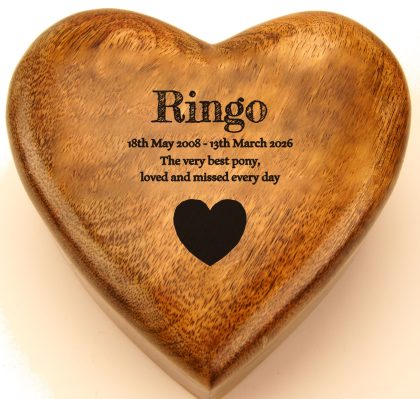 Name, dates and a heart engraved on a mango wood heart urn